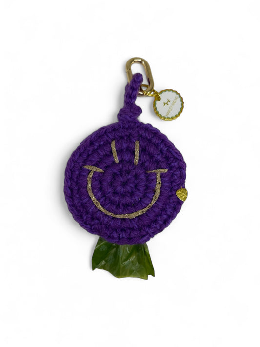 Smiley poepzakje paars